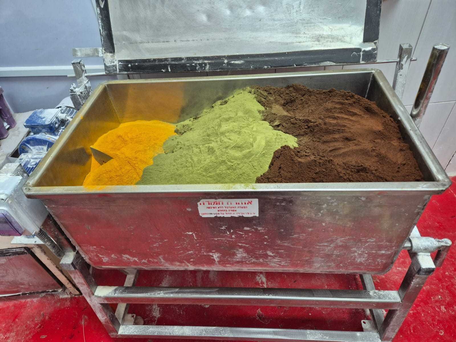 Blending and packing Golani Coffee by hand