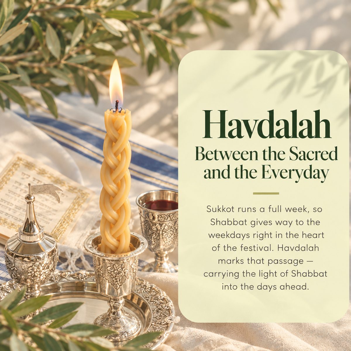 A lit braided havdalah candle with a silver spice tower and wine cup